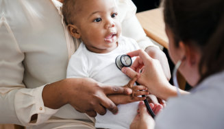 doctor checking on child