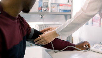 man being checked his blood pressure