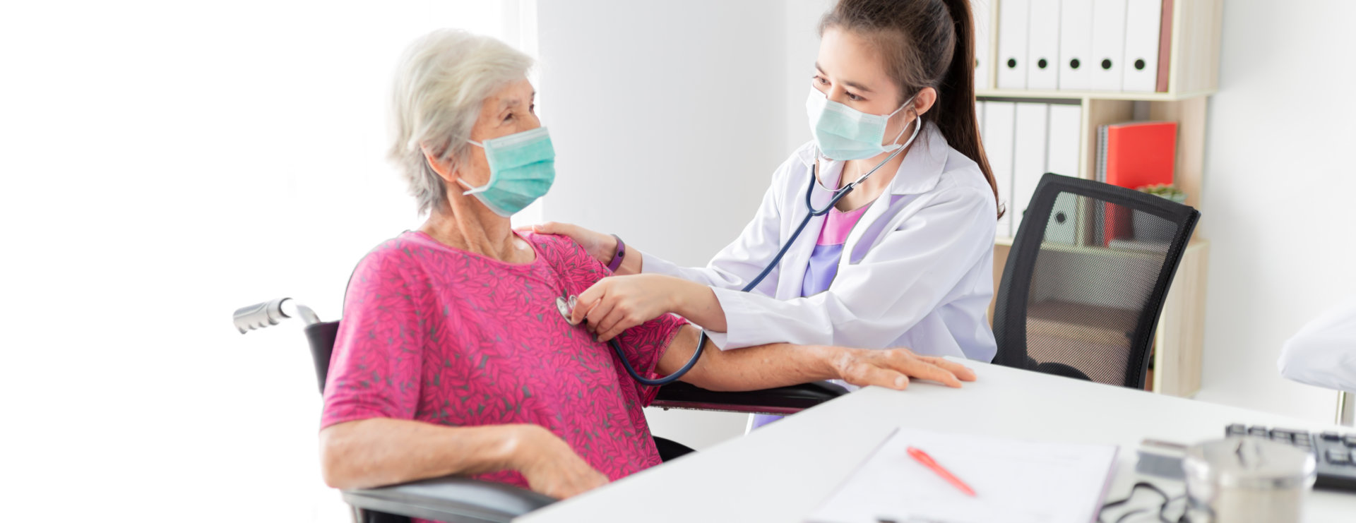 senior woman being checked by her doctor