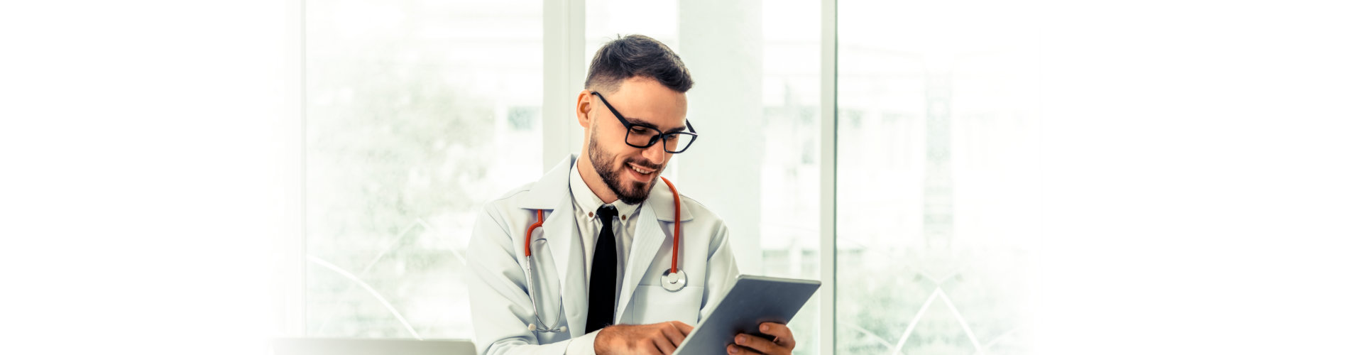 Doctor working on tablet computer